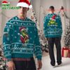 Personalized Jacksonville Jaguars NFL Team Color Grinch Ugly Christmas Sweater 1 Personalized Jacksonville Jaguars NFL Team Color Grinch Ugly Christmas Sweater