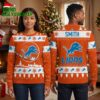 Detroit Lions Leaping Lion Snowy Village Ugly Christmas Sweater 2 detroit lions leaping lion snowy village ugly christmas sweater