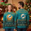Miami Dolphins Santa Claus Moonlight Ugly Christmas Sweater 1 miami dolphins santa claus moonlight ugly christmas sweater