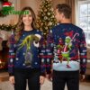 Atlanta Braves Grinch Holding World Series Trophy Ugly Christmas Sweater 1 atlanta braves grinch holding world series trophy ugly christmas sweater