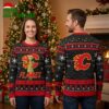 Calgary Flames Grinch In Santa Hat Ugly Christmas Sweater 1 calgary flames grinch in santa hat ugly christmas sweater