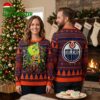 Edmonton Oilers Grinch Hug With Christmas Lights Ugly Christmas Sweater 2 edmonton oilers grinch hug with christmas lights ugly christmas sweater
