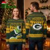 Green Bay Packers Grinch Holding Football Green And Gold Ugly Christmas Sweater 1 green bay packers grinch holding football green and gold ugly christmas sweater