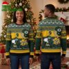 Green Bay Packers Snoopy And Charlie Brown Helmet Ugly Christmas Sweater 2 green bay packers snoopy and charlie brown helmet ugly christmas sweater