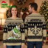 New Orleans Saints Grinch Playing Football Ugly Christmas Sweater 2 new orleans saints grinch playing football ugly christmas sweater