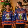 New York Islanders Grinch Santa Hat Logo Ugly Christmas Sweater 2 new york islanders grinch santa hat logo ugly christmas sweater