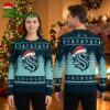 Seattle Kraken Santa Hat Logo And Snowflakes Ugly Christmas Sweater 2 seattle kraken santa hat logo and snowflakes ugly christmas sweater