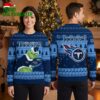Tennessee Titans Grinch Holding Team Hat Ugly Christmas Sweater 1 tennessee titans grinch holding team hat ugly christmas sweater