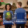 Vancouver Canucks Grinch Hugging Team Logo Ugly Christmas Sweater 1 vancouver canucks grinch hugging team logo ugly christmas sweater